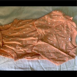 Long sleeve orange polka dots one piece.